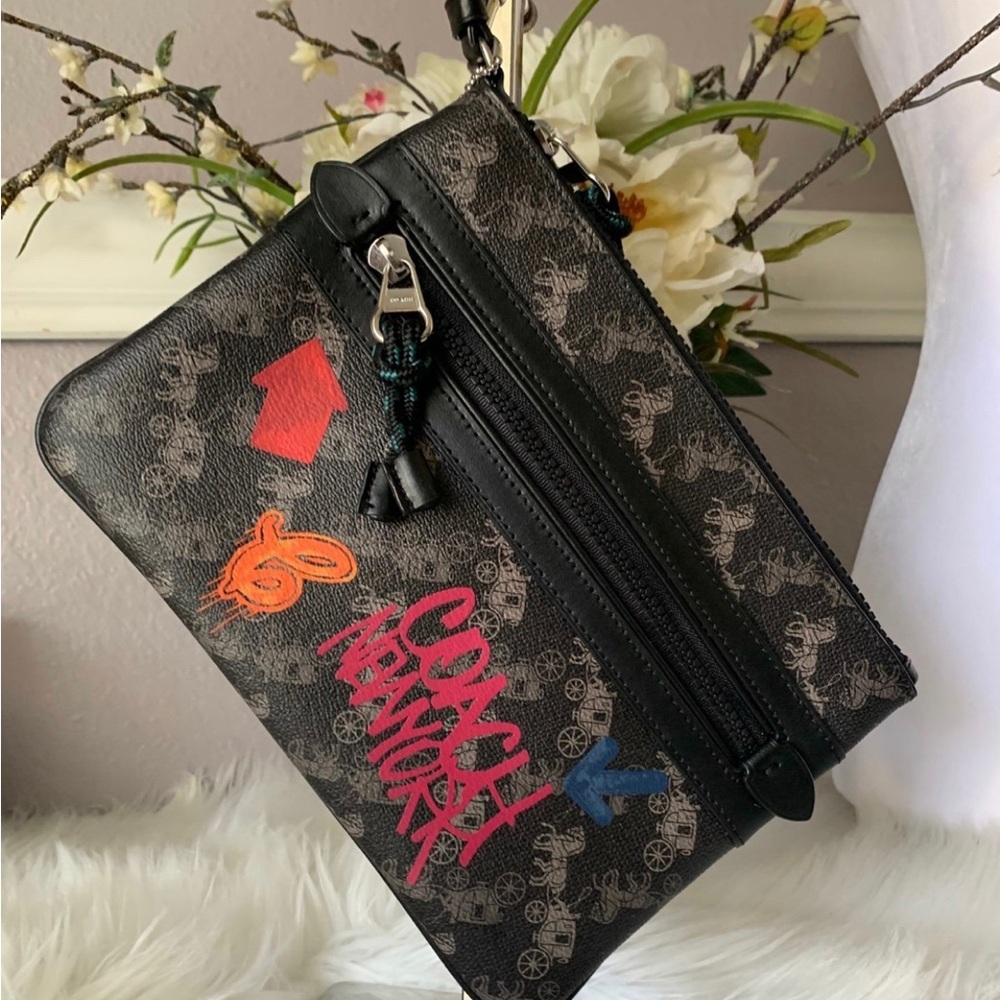 NWOT COACH Large Front Zip Wristlet Horse And
Carriage and Graffiti print